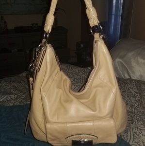 Bone colored Coach bag.